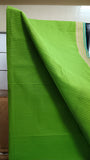 Close-up view of elegant dark green stripes block printed on the vibrant parrot green cotton saree body.