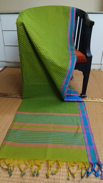 Refreshing and vibrant green cotton saree featuring a captivating geometric print and contrasting blue border. Perfect for adding a touch of energy to your daily wear. 