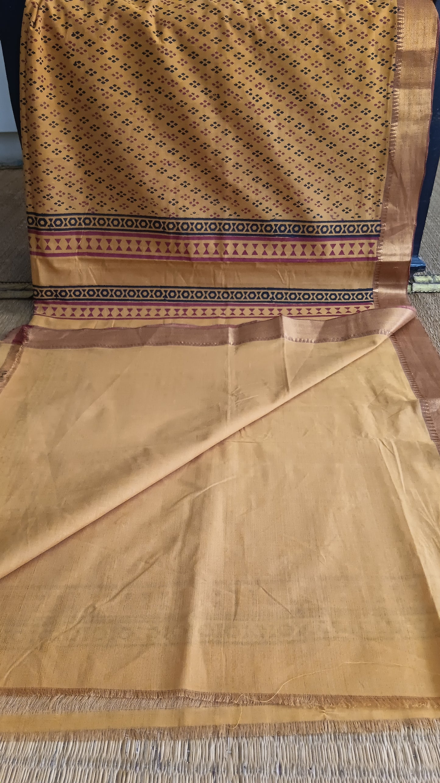 View from the top of the plain blouse of a Mustard function wear Mangalgiri cotton saree