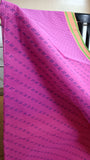 Close-up view of the delicate geometric block print design in blue on the comfortable cotton saree body.