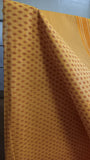 Close-up view of the simple geometric block print design on the sunshine yellow cotton saree body.