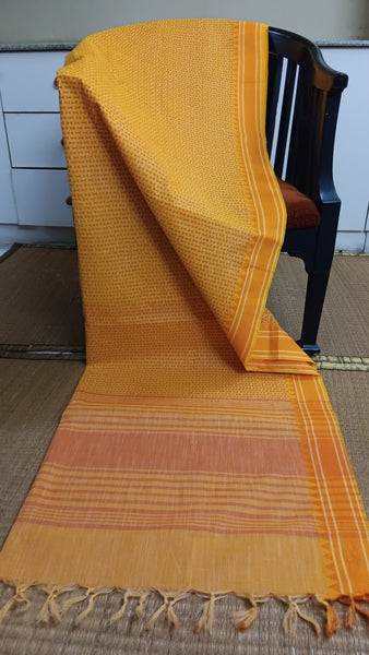 Vibrant yellow cotton saree featuring a captivating geometric print, perfect for adding a touch of sunshine and modern flair to your daily wear.