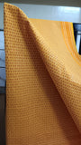  Close-up view of the intricate geometric print on the sunshine yellow cotton saree body.