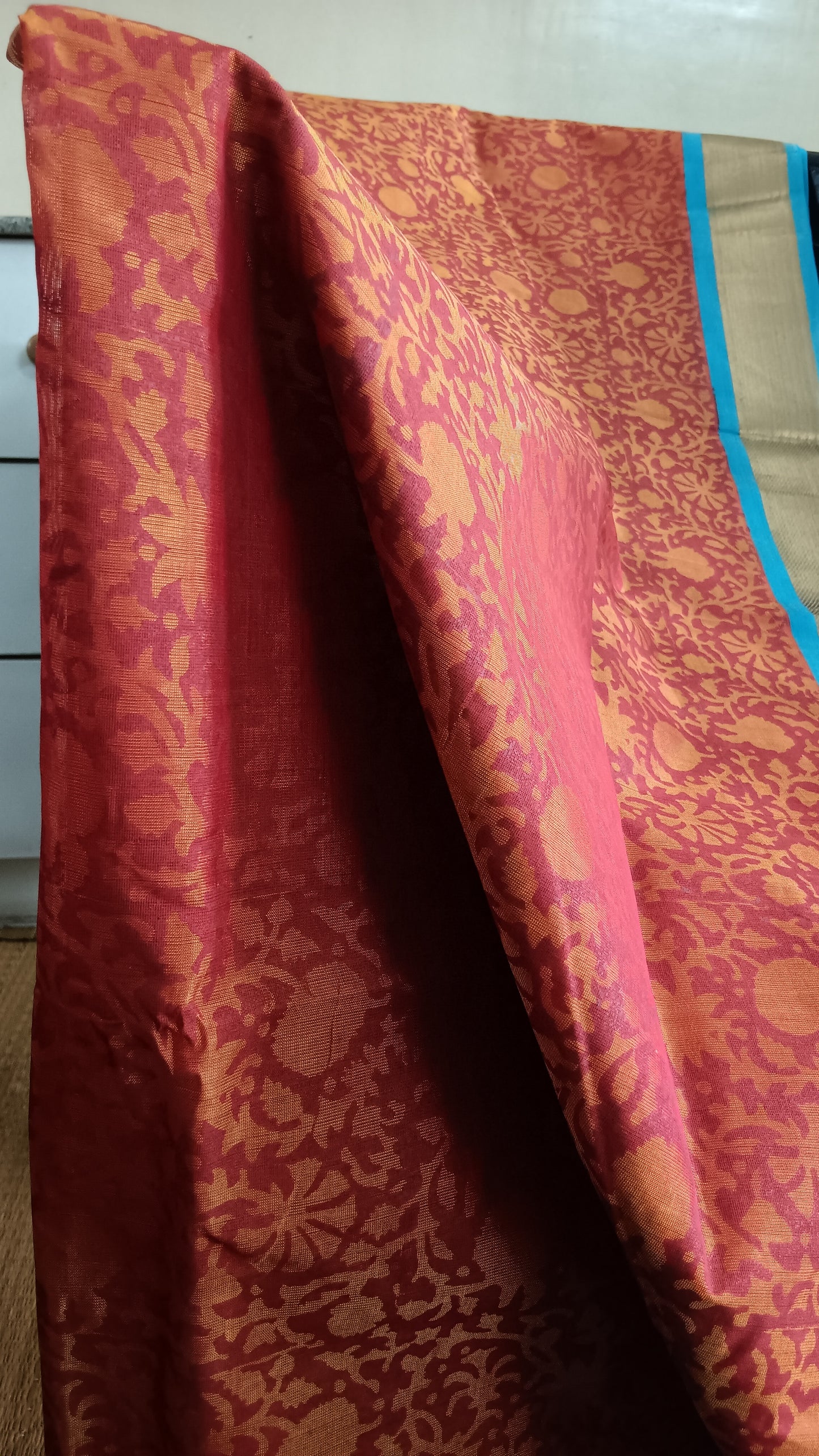 close up view of the abstract patterns block printed on the body of a hand woven silk cotton saree