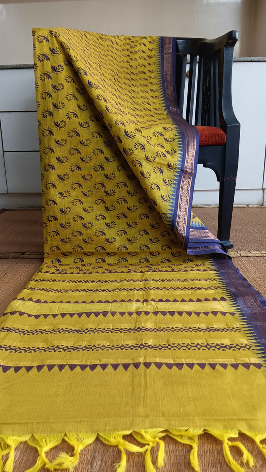 Yellow function wear cotton saree with blue zari border woven on powerloom in South india