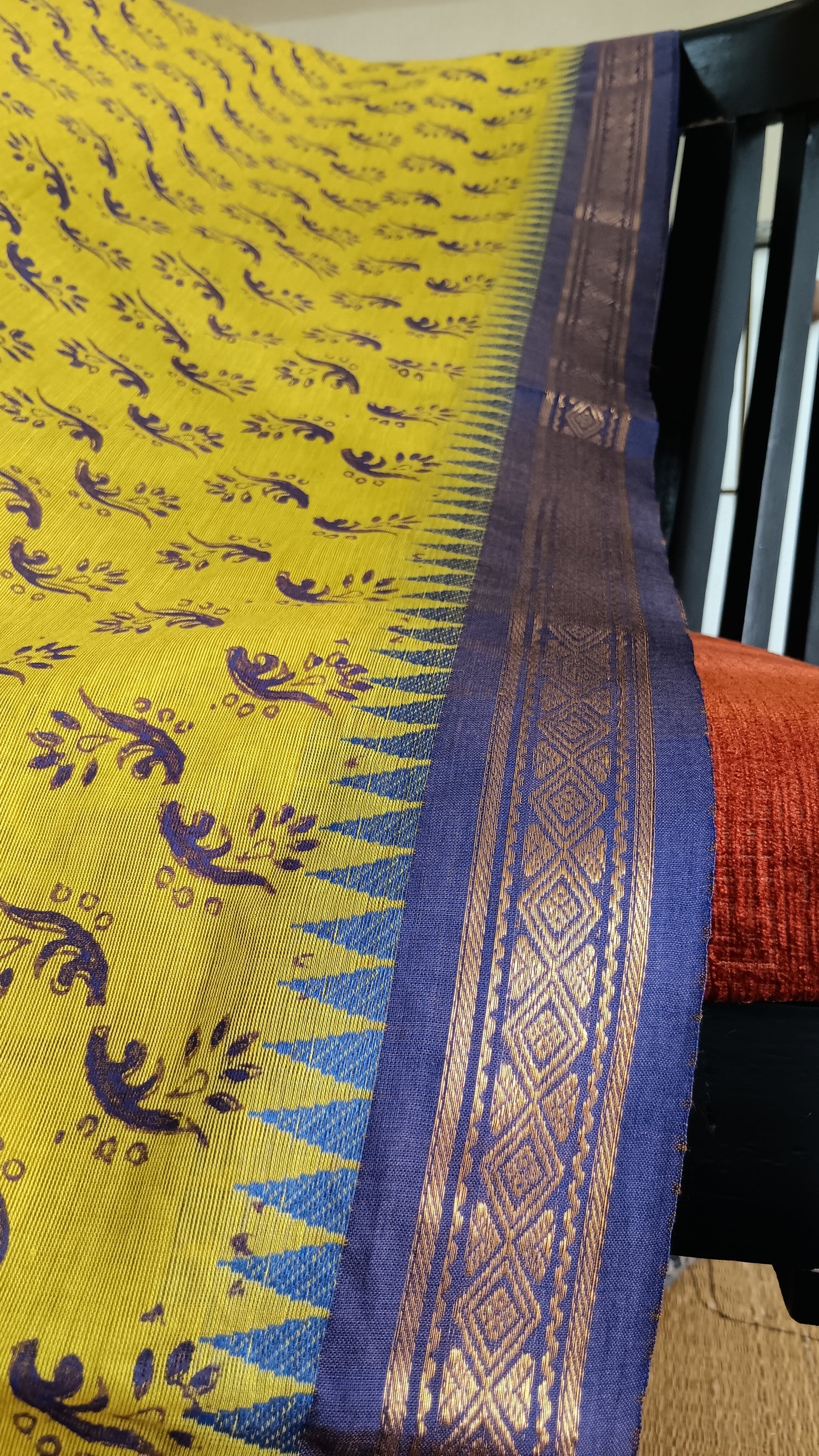 Close up view of the zari border of a function wear cotton saree