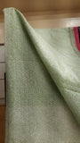 close up of the body of a kota cotton saree hand block printed with delicate geometric patterns in green on the body