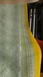 close up of the green and yellow border of a light weight kota cotton saree