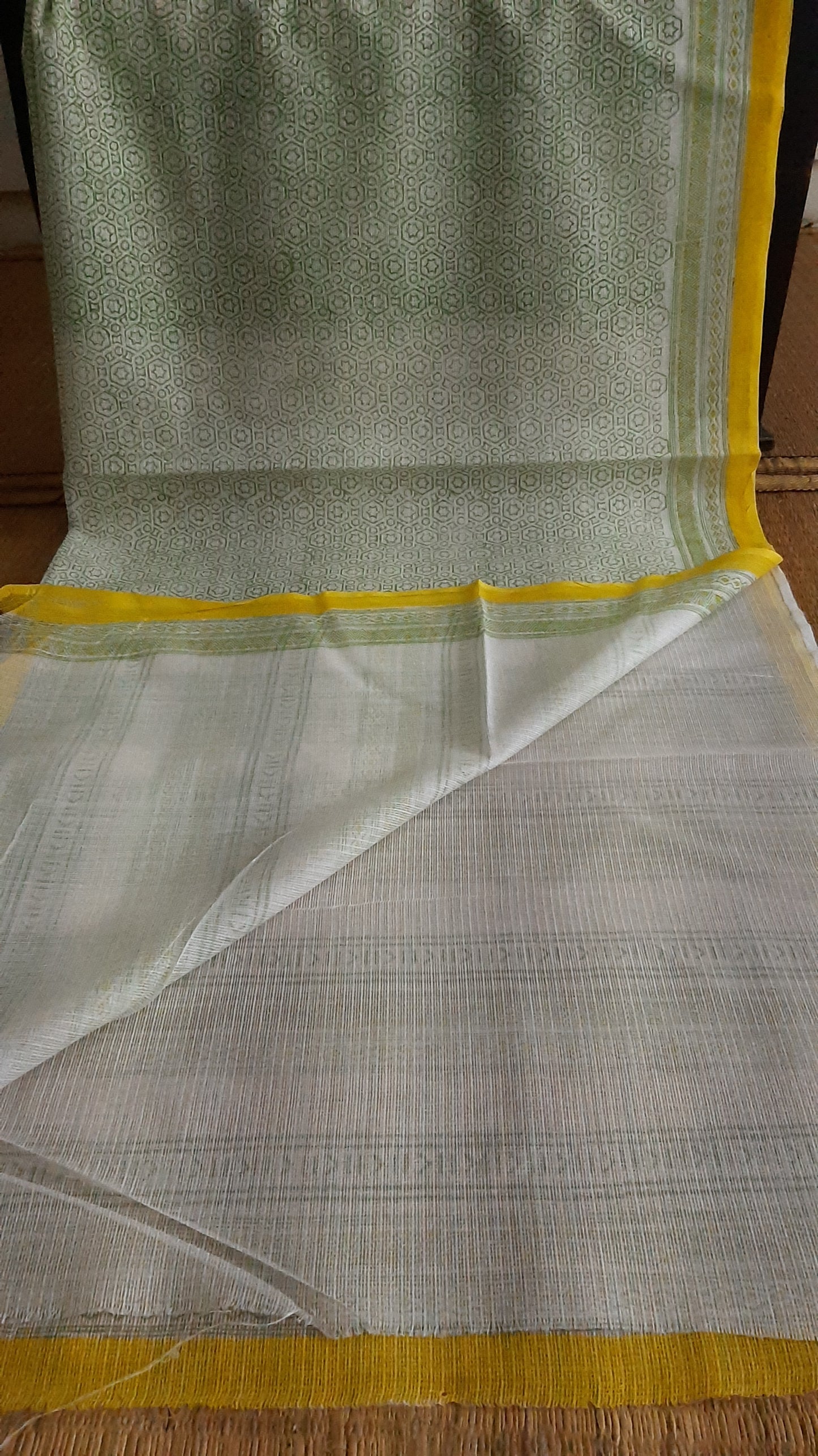 Plain white blouse of a green and yellow kota cotton saree