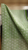 close up view of the body of a daily use kota cotton saree with bold geometric prints in green