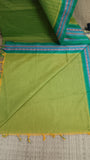 Plain green cotton blouse included with the saree.