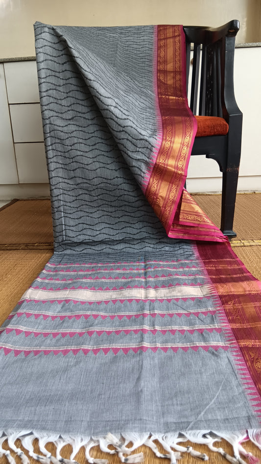 Grey block printed function wear cotton saree with pink zari border