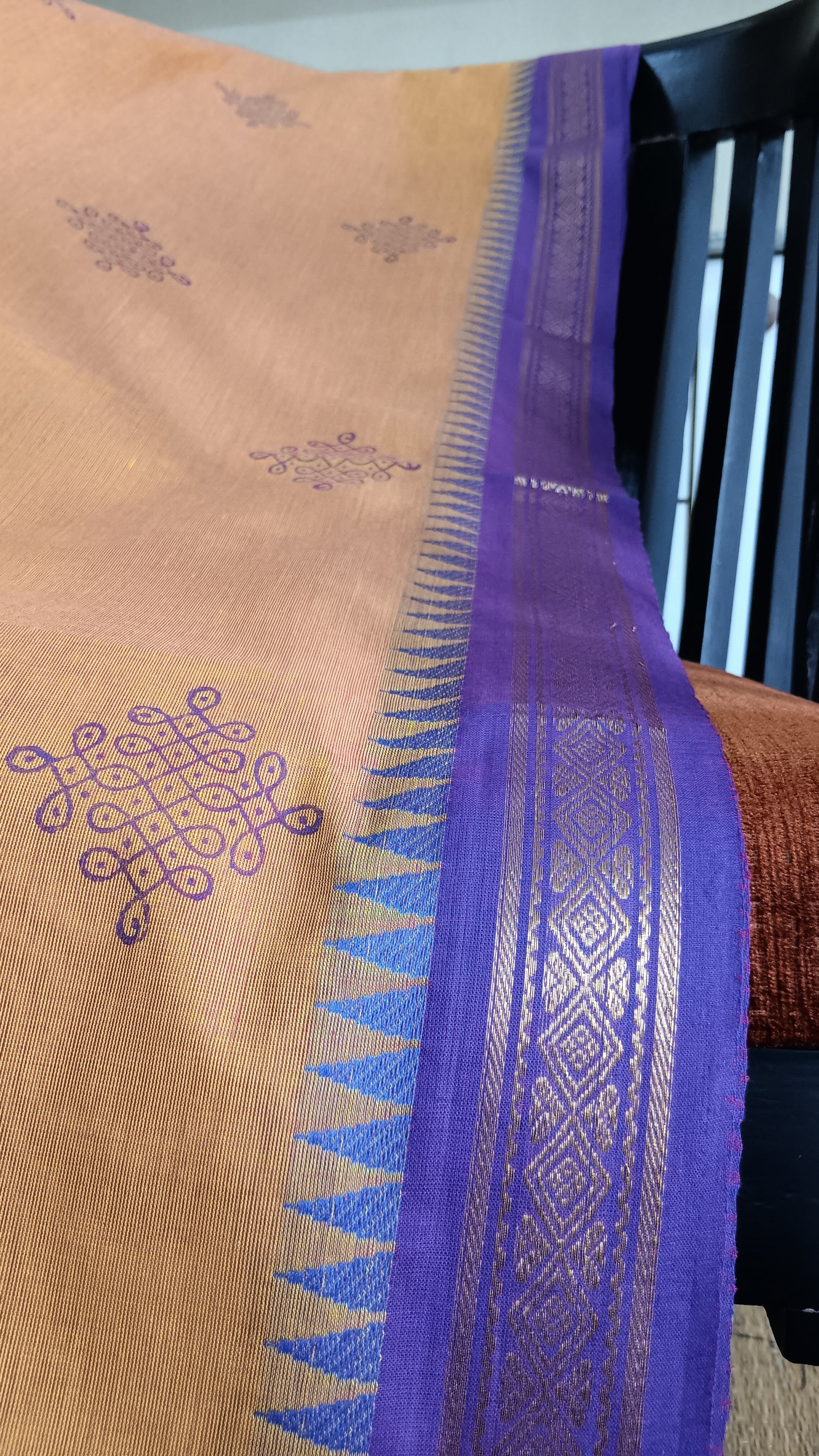 Close up view of the zari border of a south cotton function wear cotton saree