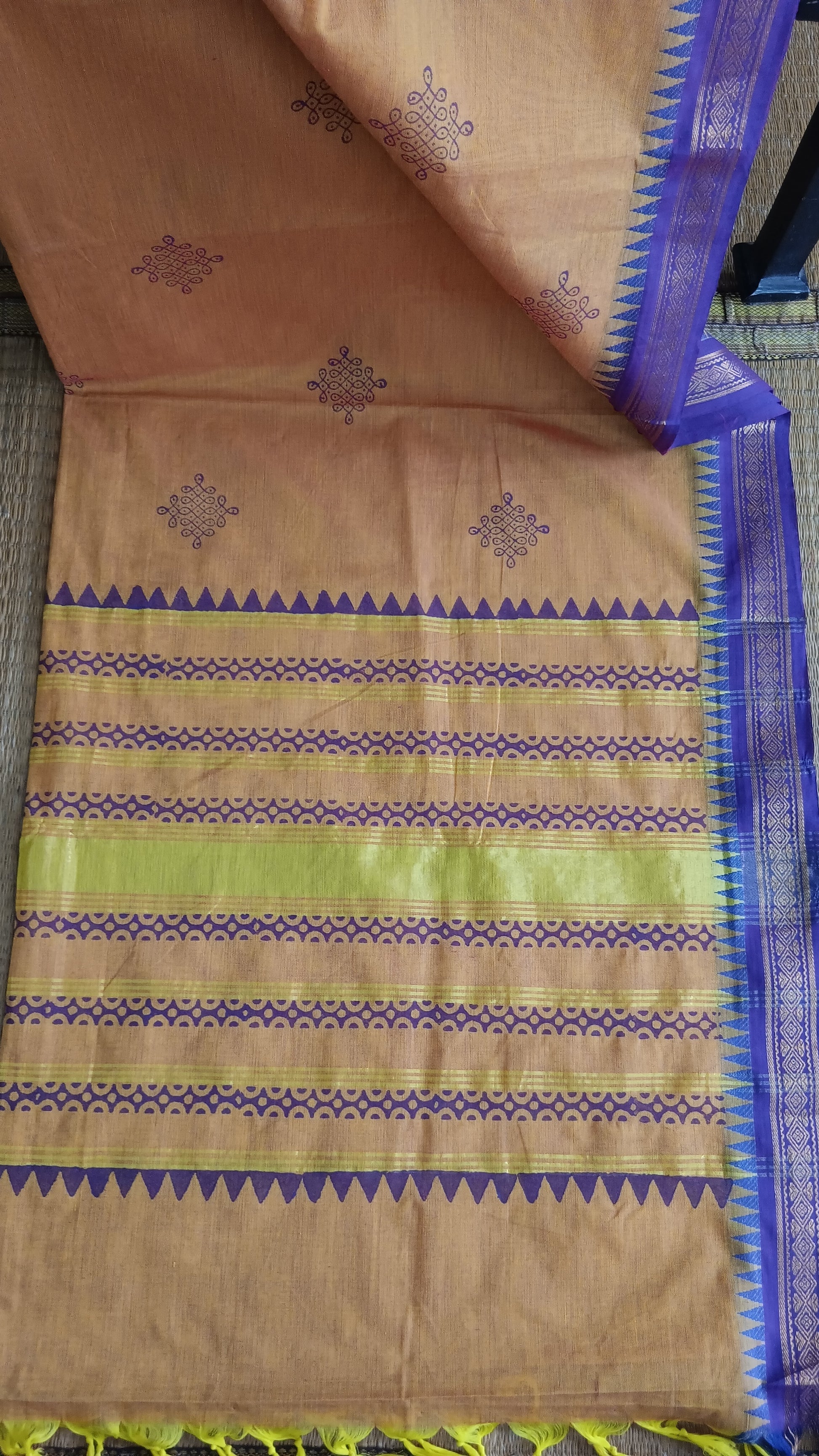 View from the top of the block printed pallu of a south cotton saree for function wear