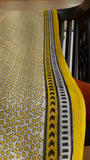 close up of the black and yellow block printed border of a kota cotton saree