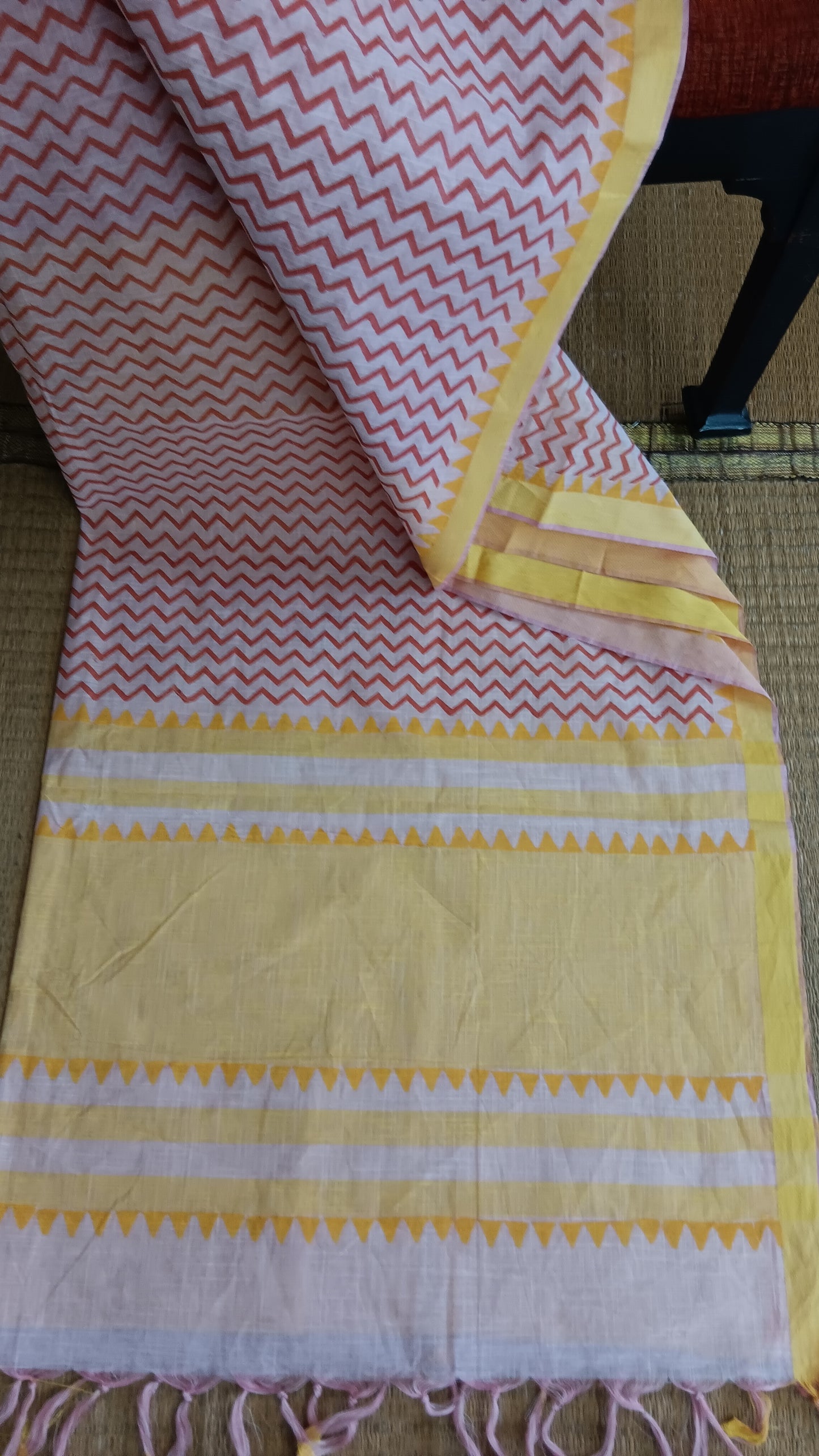 view from the top of the yellow pallu of a cotton saree for daily use