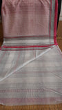 CLose up view of a plain white blouse of a block printed pink kota cotton saree