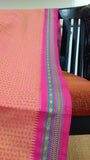 Close-up of the saree's plain dark pink border.