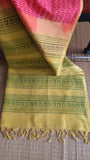 Top view of mustard yellow printed pallu on handwoven pink silk cotton saree.