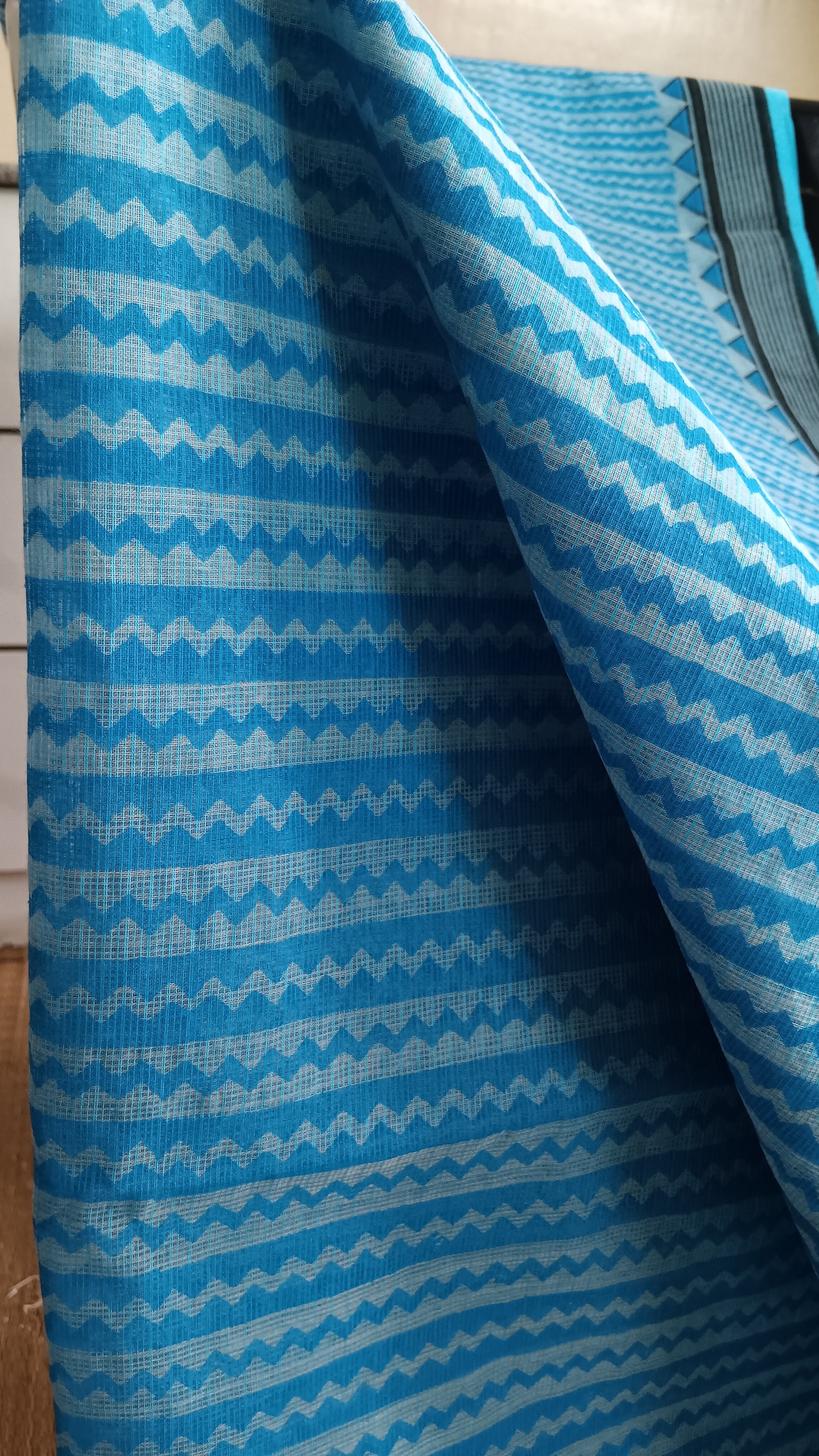 Close up view of the geometric pattern block printed on the body of a light weight daily use kota cotton saree