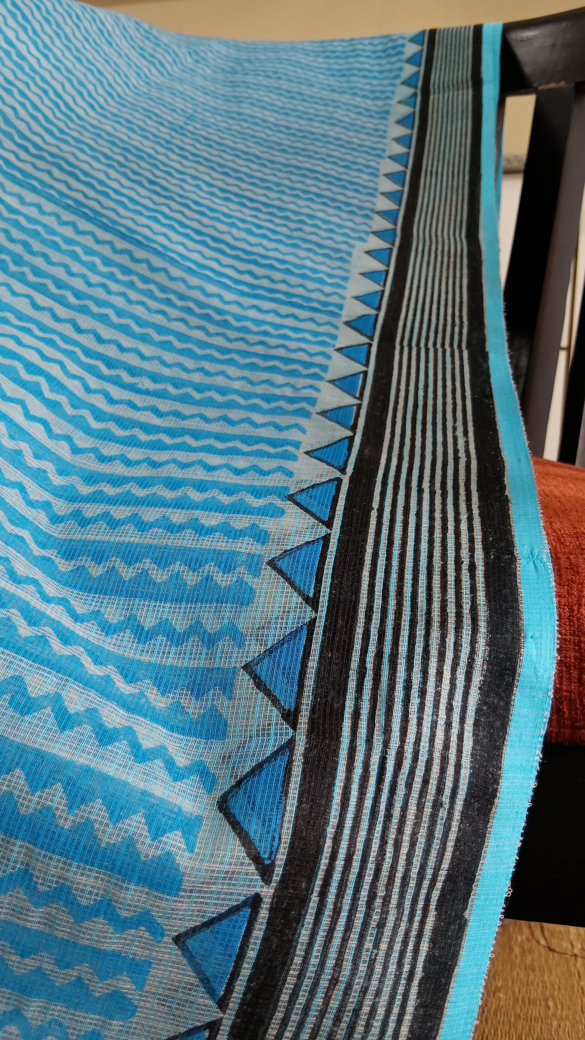 Close up view of the border block printed on a blue light weight daily wear kota cotton saree