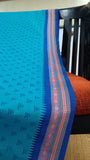 Close-up of the saree's elegant woven thread border, showcasing intricate details and traditional craftsmanship.