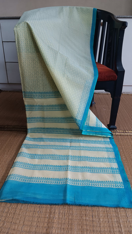 Yellow Kota cotton saree with hand block printed light blue geometric patterns on body, border, and pallu.  pen_spark