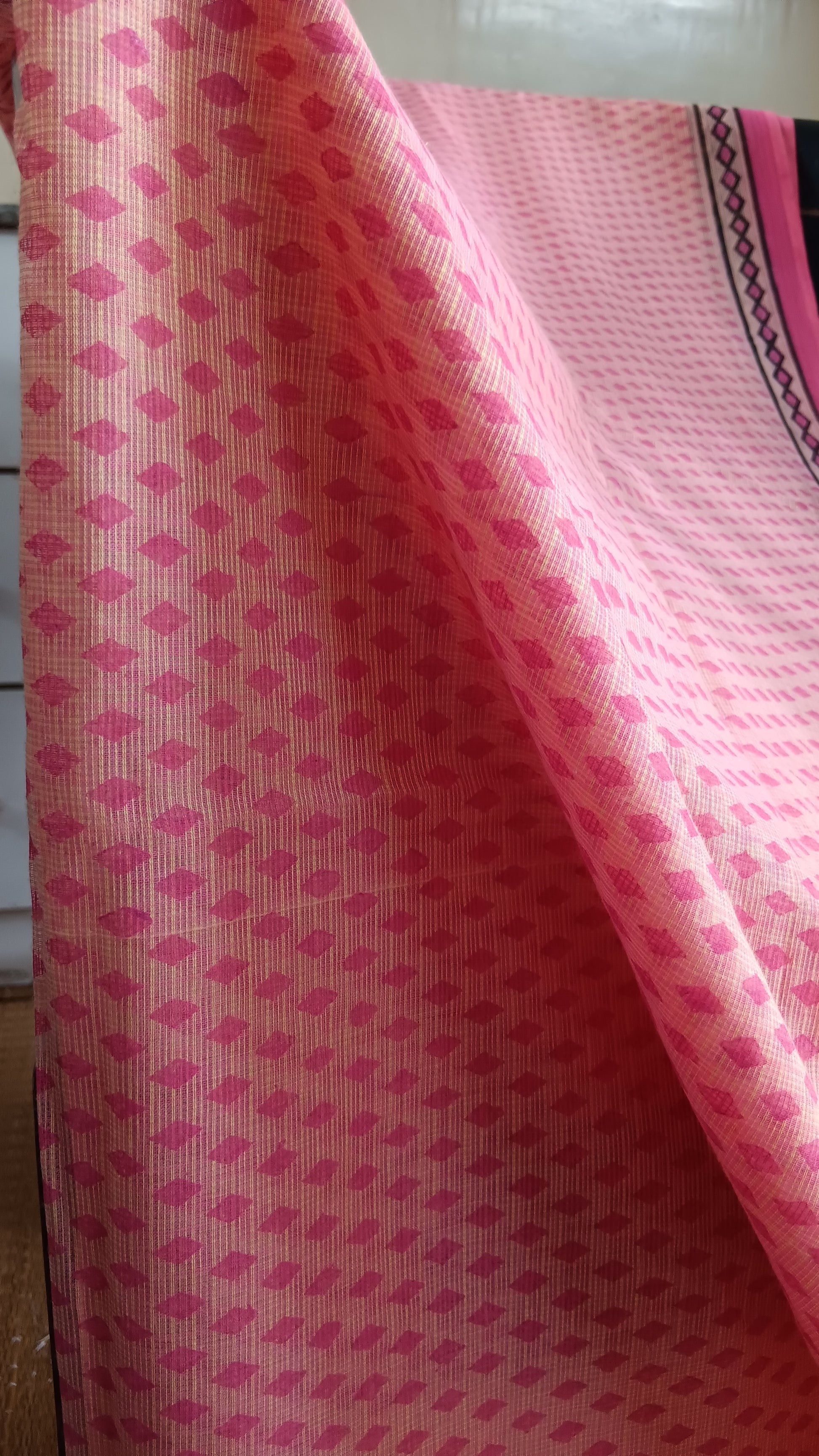Close up view of the geometric pattern block printed on the body of a light weight daily wear kota cotton saree