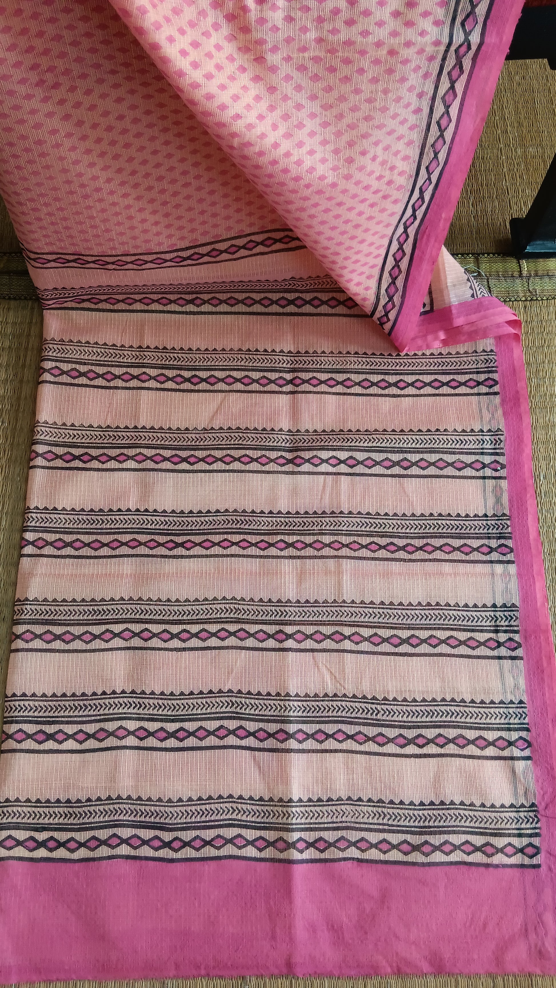View from the top of the block printed pallu of a pink light weight daily wear kota cotton saree