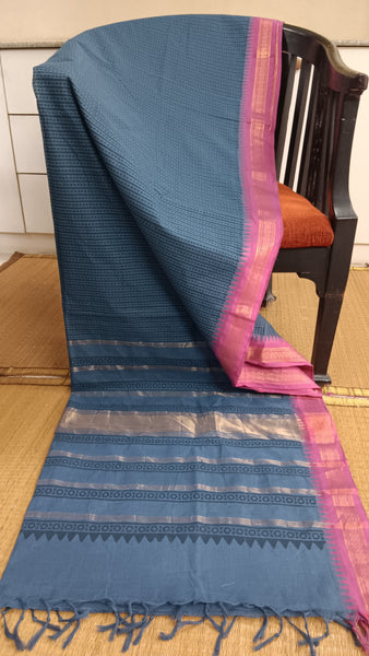 Grey cotton saree with a vibrant pink border, ideal for work or family functions.
