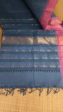 Top view of the saree's pallu, showcasing the grey cotton with geometric prints.