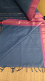 Plain grey cotton blouse included with the saree.