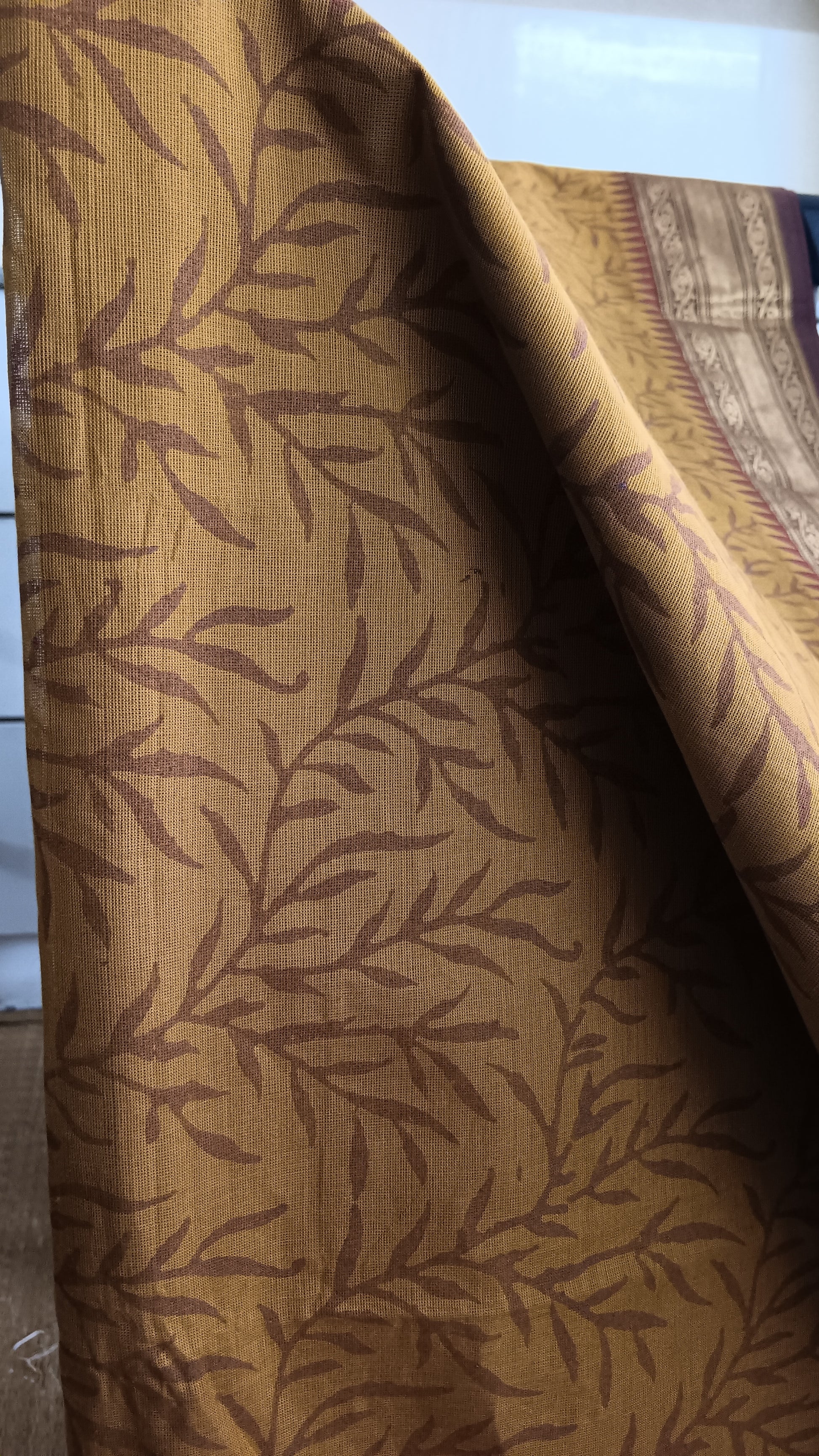 Close up view of the block printed body of a traditional south cotton function wear saree