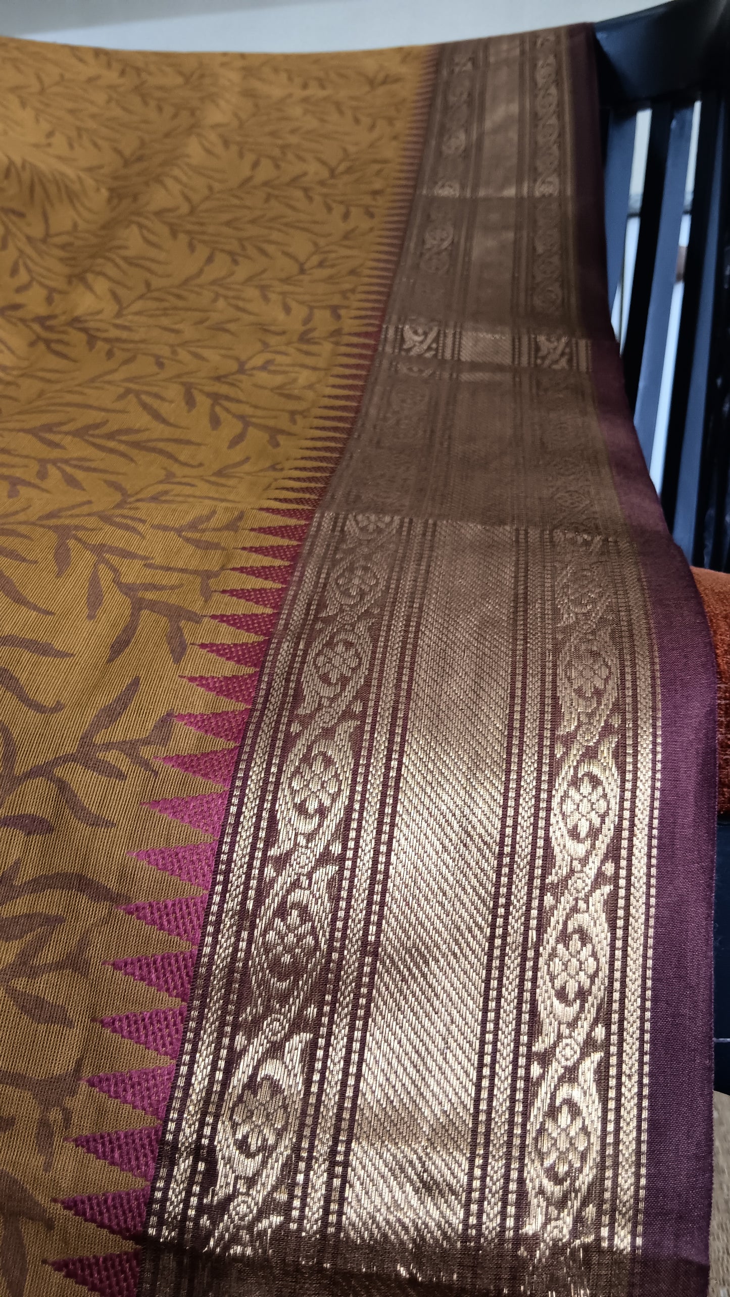 Close up view of the rich zari border of a south cotton funtion wear saree