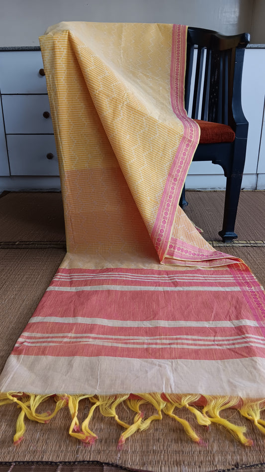 block printed yellow cotton saree with pink border and pallu